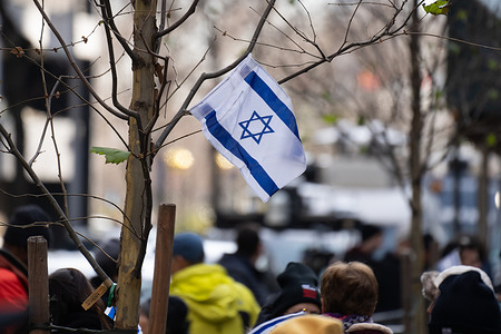 A small Israeli flag is placed on a tree branch during a rally demanding for the release of Israeli hostages kidnapped by Hamas at Dag Hammarskjold Plaza outside of the UN Headquarters. January 12th marks the 100th day of said hostages being held in captivity since the attack on Israel on October 7th, 2023.