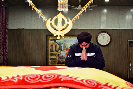 A Sikh devotee prays on the occasion of the 357th birth anniversary of the 10th Sikh Guru Gobind Singh inside the Chati -Patshahi Gurudwara or Sikh temple in Srinagar. Guru Gobind Singh, the tenth and last human Sikh Guru, was born on December 22, 1666, and passed away on October 7, 1708. At just nine years old, he became the Sikh leader after his father's execution. Besides being a warrior, poet, and philosopher, he made important contributions to Sikhism. In 1699, he founded the Sikh warrior community called Khalsa and introduced the Five Ks, which are articles of faith that Khalsa Sikhs wear all the time.