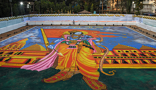 A Rangoli, a traditional Indian art form using colored powder, depicting the Hindu deity Lord Ram, adorns the ground in Mumbai. This intricate design is created to commemorate the consecration of Lord Ram's temple in Ayodhya, Uttar Pradesh.