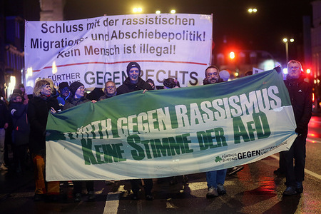 Protesters march with an anti-racism banner during the demonstration. Protesters assembled for a demonstration and march, united in their call to denounce the far-right Alternative for Germany (AfD) and the deportation objectives of right-wing extremists.