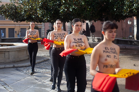(EDITORS NOTE: Image contains nudity)
Topless naked femen Spain activists carry Spanish flags as they perform an action at Plaza de San Andrés in the center of Madrid. Activists from Femen España carried out an action to denounce the femicides and the sexist denialism of the Spanish conservative sectors. The action took place at Plaza de San Andrés in Madrid.