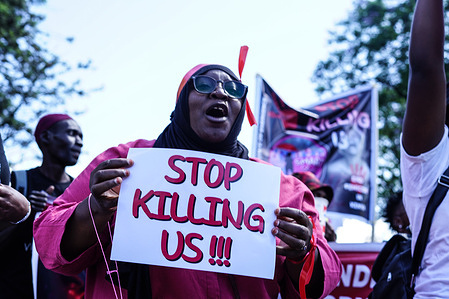 A protester marches while holding a placard during the demonstration. Protesters marched countrywide during the ‘Feminists March Against Femicide,' which was sparked by the recent brutal murders of Starlet Wahu, 26, and Rita Waeni, 20, in Kenya. Findings from 2022 national survey shows that over one in three women in Kenya experience physical violence in their lifetime.