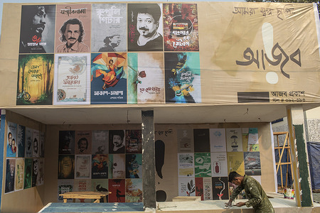 Stalls are bedecked in posters and colours ahead of the opening of the Amar Ekushey Book Fair at Dhaka Suhrawardy Udyan.