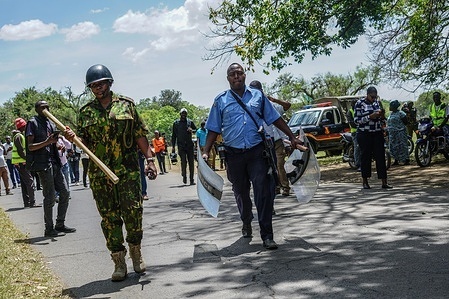 Armed police officers are seen walking on the disputed land in Nakuru trying to maintaining law and order. The Nakuru Government has been engaged in a month-long dispute with a privately run War Memorial Hospital over a 25-acre lot. The government wants to reclaim the land for public use, alleging that the hospital fraudulently extended its lease for another 50 years.