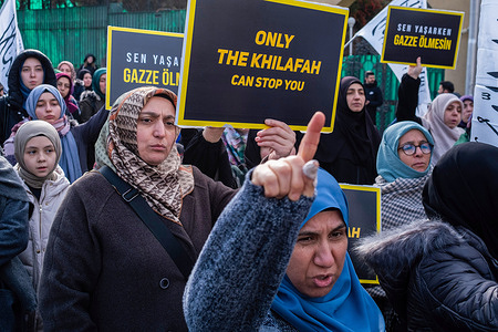 A woman holds a sign that says "Only the Khilafah" during the demonstration. The group "Radical Change" held a press conference titled "Gaza is Dying" in front of the Egyptian Embassy in Ankara, condemning Israel's attacks on Gaza and advocating for a ceasefire.