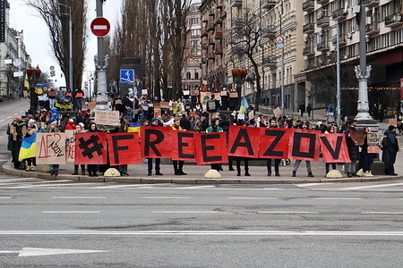 Protesters hold FREE AZOV placards during a demonstration in support of prisoners of war. Relatives and friends of Ukrainian military prisoners of war, specifically captives from the siege of Mariupol, hold placards reading "Free Azovstal defenders" during a rally calling for their exchange with Russian prisoners of war, in Kyiv amid the Russian invasion in Ukraine.