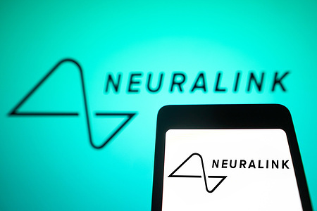 In this photo illustration, the Neuralink logo is displayed on a smartphone screen and in the background.