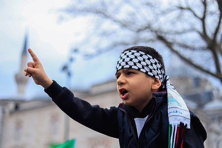 A Turkish child chants slogans during a protest against the Israeli attacks on Palestine. The Humanitarian Relief Foundation IHH organized a large demonstration in Beyazit Square in Istanbul, to protest the Israeli aggression on Gaza and call for a ceasefire.