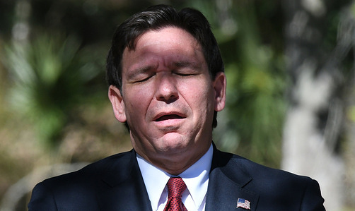 Florida Gov. Ron DeSantis reacts when asked whether he would run for the U.S. Senate seat held by Rick Scott during a press conference at Blue Springs State Park in Orange City. During his remarks, DeSantis highlighted the state’s successful efforts to protect Florida’s manatees and improve water quality.