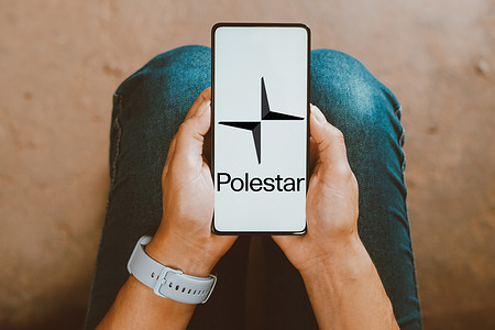 In this photo illustration, the Polestar logo is displayed on a smartphone screen.