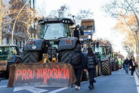 Tractors are seen blocking one of the city's main streets, Gran Via, during the demonstration. Farmers across Europe are protesting against what they see as unfair EU regulations, rising prices, competition from outside Europe, and low yields caused by climate change. They're staging marches with their tractors, blocking highways, and causing chaos in city centers to voice their concerns.