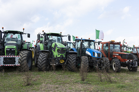 Tractors are parked in a field near Rome's GRA (ring road) on the outskirts of Rome waiting to enter the city as part of the protest by Italian farmers to pressure the government to improve their working conditions. Italy is one of several European countries where farmers have staged weeks of demonstrations to demand lower fuel taxes, better prices for their products, and an easing of EU environmental regulations that make it more difficult to compete with cheaper foreign produce.