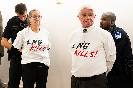 Activists against LNG (Liquified Natural Gas) being arrested after being escorted out of a hearing of the Senate Energy and Natural Resources Committee at the U.S. Capitol.