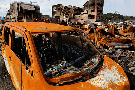 A burnt car sits amidst charred houses following the Noto Peninsula earthquake that sparked a devastating fire in the area. The Noto Peninsula earthquake took 241 lives, with devastating effects in Kawai-cho. More than 200 houses, including a popular tourist spot called "morning market street," were destroyed. This area, known for its fresh fish, vegetables, and traditional crafts like Wajima-nuri chopsticks, attracted hundreds of thousands of visitors yearly. However, the fire that followed the quake left nothing but ashes.