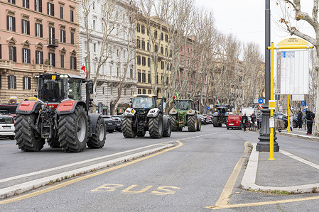 View of the Italian farmers tractors passing through the streets of Rome. Hundreds of tractors gathered outside Rome driven by farmers as part of a European wave of protests against the cutting of their produce by cheaper imports from third countries, rising fuel costs and the impact of government measures.