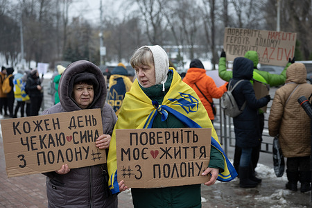 Relatives of the Azovstal defenders and other Ukrainian prisoners of war hold placards during a rally in central Kyiv calling for authorities to return their relatives from Russian captivity.
