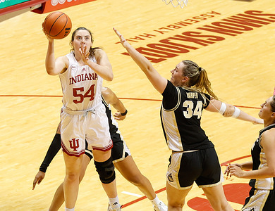 Indiana Hoosiers forward Mackenzie Holmes (54) scores a basket making her the All-Time highest scoring women's basketball player at IU during a game against Purdue. The Hoosiers beat the Boilermakers 95-62.