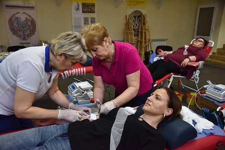 A woman donates blood for the Ukrainian military at the Soldier's House in Lviv. Amidst the Russian-Ukrainian conflict, Blood Centers face an ongoing demand for blood donations to support the Ukrainian military defending against the Russian invasion. In response, these centers not only conduct regular blood drives but also set up mobile collection points, extending their reach beyond urban areas. Notably, an event was hosted at the Soldier's House in Lviv, enabling civilians to contribute blood specifically for the Ukrainian military.