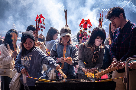 Worshippers seen lighting their joss sticks for worshipping at the Che Kung Temple, Hong Kong. People flocked to the Che Kung Temple to worship on the third day of the Lunar New Year as a tradition in Hong Kong, celebrating the Lunar New Year and the Year of Dragon in Chinese zodiac.