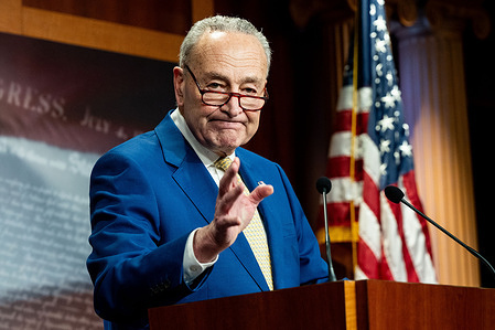 Senate Majority Leader Chuck Schumer (D-NY) waves after his speech at a press conference at the U.S. Capitol.