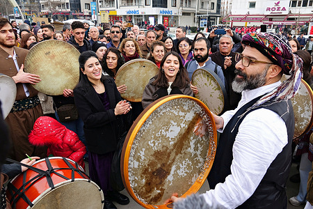 Ma Music Centre artist Serko (R)) and his friends play the tambourine as they take part in the demonstration. On the 25th anniversary of the leader of the Kurdistan Workers' Party (PKK) Abdullah Ocalan's arrest, the Democratic Regions Party (DBP) arranged marches and demonstrations in Kurdish-populated areas. They demanded a democratic solution to the Kurdish issue and Ocalan's release. Police obstructed some protesters, prompting five deputies to conduct a sit-in protest, resulting in traffic disruptions. At least four people were detained by police.