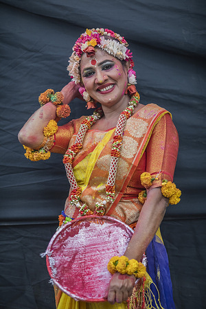 A woman wearing floral ornaments and the colours of spring poses during Basanta Utsav the first day of spring season. Pohela Falgun also known as the first day of spring of the Bengali month Falgun, is a holiday celebrated in Bangladesh. People gathered at the Dhaka University campus to welcome the first day of Basanta Utsav (spring festival) in Dhaka.