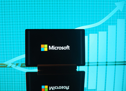 In this photo illustration, the Microsoft Corporation logo seen displayed on a tablet.