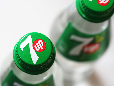 In this photo illustration, glass bottle of 7up seen displayed.