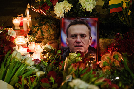 Flowers, candles, and a picture of the late Russian opposition leader Alexei Navalny are seen at a makeshift memorial at the monument to victims of political repression. Alexei Navalny, the most prominent domestic opponent of Russian President Vladimir Putin, reportedly died on February 16 at an Arctic prison colony in the Yamalo-Nenets region of northern Siberia. He was serving a 19-year sentence. Authorities claim that Navalny fell unconscious and passed away after a walk at the "Polar Wolf" Arctic penal colony, where he was serving his sentence.