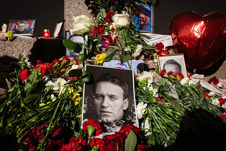A view of a spontaneous memorial in memory of the deceased Russian oppositionist Alexei Navalny, organized at the monument to victims of political repression on Voskresenskaya Embankment. Russian opposition leader Alexei Navalny reportedly died in the IK-3 prison colony, known as the "Polar Wolf," in the Yamalo-Nenets Autonomous Okrug, according to the press service of the Federal Penitentiary Service. Prison authorities indicated that Navalny felt unwell after a walk on Friday. He was last seen in good spirits during a court video link appearance just a day before.