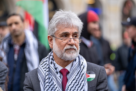 Mahmoud Khalifa, Palestinian ambassador to Poland, speaks during a pro-Palestinian protest in Warsaw. Hundreds of Pro-Palestinian demonstrators gathered in pouring rain in Warsaw's center to protest. During the demonstration, the crowd chanted slogans like "Free Palestine" and criticized Israel by calling it a "terrorist state."