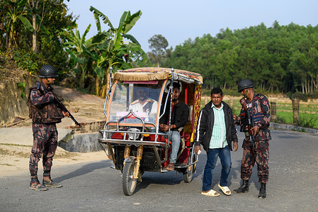 Members of the Border Guard Bangladesh (BGB) are checking civilians in the Naikhongchori area near the Bangladesh-Myanmar border in the Bandarban district of Bangladesh. The Border Guard Police (BGP) conflict with the Arakan Army, an armed rebel group inside Myanmar, continues unabated. Sustained firing, the sound of mortar shells bursting could be heard across the Bangladesh-Myanmar border area. Bullets and mortar shells fired from Myanmar are coming across the border in the towns of Bangladesh.