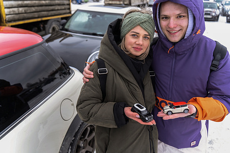 Owners of Mini Cooper cars hold toy replicas of their cars in their hands during a flash mob. Fans of the Mini Cooper brand in Moscow and the region joined the international flash mob "I LOVE MINI" for the ninth time.