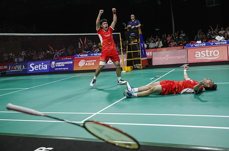 Xie Hao Nan (L) and Zeng Wei Han of China celebrate winning against Aaron Chia and Soh Wooi Yik of Malaysia (not pictured) during the Men's Doubles final match at the Badminton Asia Team Championships 2024 at Setia City Convention Centre in Shah Alam. Xie Hao Nan and Zeng Wei Han won with scores; 21/16/23 : 16/21/21.