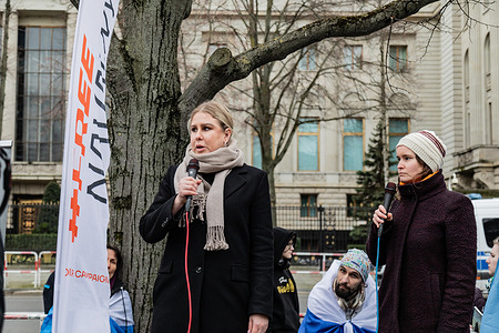 Exiled Russian opposition politician and lawyer Lyubov Sobol (C) speaks during a mass demonstration in front of the Russian embassy in Berlin following the death of Russian opposition leader Alexey Navalny.