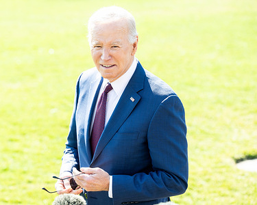 President Joe Biden speaks to reporters near the South Lawn and the Rose Garden before leaving the White House via Marine One to start a trip to California.