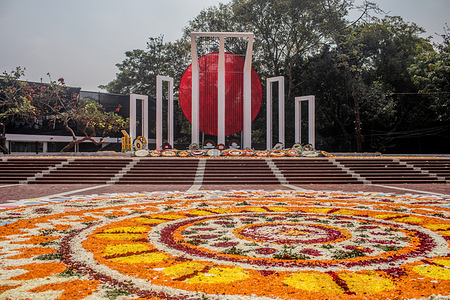 The martyr's monument Central Shaheed Minar is decorated with flowers during the International Mother Language Day. Bangladeshis pay tribute at the Martyr's Monument, or Shaheed Minar, on International Mother Language Day in Dhaka. International Mother Language Day is observed in commemoration of the movement where a number of students died in 1952, defending the recognition of Bangla as a state language of the former East Pakistan, now Bangladesh.