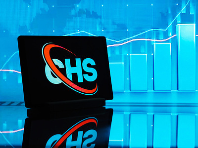 In this photo illustration, CHS Inc. logo seen displayed on a tablet.