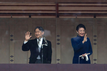 Japan's Emperor Naruhito (L) and Empress Masako(R) wave to well-wishers on the balcony of the Imperial Palace on February 23, 2024, in Tokyo, Japan. Emperor Naruhito appeared to greet the public on his 64th birthday, flanked by Empress Masako and other members of the Japanese Royal Family.