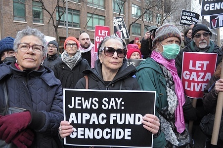 Pro-Palestine demonstrators hold placards expressing their opinion at a rally. Demonstrators marched in Manhattan, New York City condemning the pro-Israel lobbying group, the American Israel Public Affairs Committee, or AIPAC. Protestors opposed AIPAC for influencing U.S. policies to support the Israel Defense Forces' military operations in Gaza. Demonstrators also protested against New York senators Chuck Schumer and Kirsten Gillibrand for supporting Israel's war against Hamas. On Tuesday, the United Nations food agency, the World Food Program, paused food shipments to northern Gaza due to chaos in the area and Israeli bombardment. According to Gaza's Health Ministry, more than 29,000 people have been killed in Gaza since the war started on October 7, 2023.