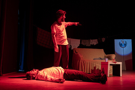 Theater actor Bahoz Ozsunar fires his gun in the last scene of the play. The play "King and Travis" staged and translated into Kurdish by Kurdish theater actors Deniz Ozer and Bahoz Ozsunar, is banned in many places where it is performed in Turkey. The play, which was banned without justification by the Governorship and District Governors, was staged for dozens of people at the Four Seasons Theater Hall in Ankara. Kurdish theater artists claim that their plays were banned on the grounds that "the play would be propaganda for an organization".