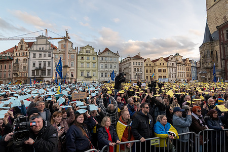 Protesters hold yellow and blue papers over their heads in order to create huge Ukrainian flag during the demonstration at the Old Town Square. Thousands of people gathered at the Old Town Square in Prague to mark the second anniversary of the Russian invasion of Ukraine. Russian troops entered Ukrainian territory on the 24th of February 2022, and started war and conflict.