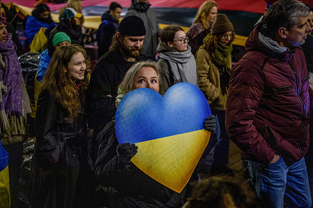 Protester holds a heart-shaped placard during a rally in support of Ukraine. A march and demonstration in support of Ukraine attended by about 1,000 people took place in Vilnius on the second anniversary of the full-scale Russian invasion.