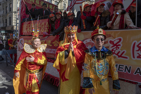 People wearing different costumes participate in the annual Lunar New Year parade in Chinatown on February 25, 2024 in New York City. People gathered to enjoy and celebrate the 26th annual Lunar New Year parade, commemorating the end of the 15 days honoring the first new moon on the lunar calendar. 2024 is the "Year of the Dragon."