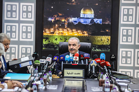 Palestinian Prime Minister Muhammad Shtayyeh is seen chairing the session, announcing the resignation of his government and calling for new political measures in Ramallah amid the ongoing war in the Gaza Strip. He said, "The next stage and its challenges require new governmental and political measures that take into account the new reality in the Gaza Strip," calling for Palestinian consensus and "extending the (Palestinian) Authority's rule over the Strip."