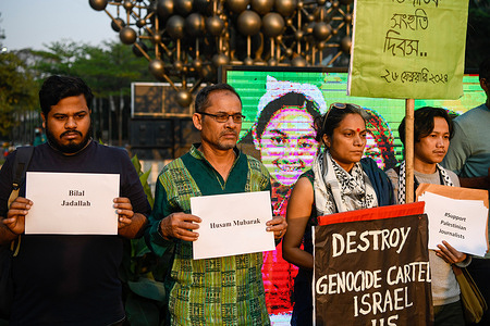 Protesters hold placards with names of journalists killed and missing, during the International Solidarity Day in support of Palestinian journalists. Bangladeshi journalists, media workers, and activists from various organizations gathered to observe a moment of silence and show solidarity with Palestinian journalists affected by the Israel-Gaza conflict. The event aligns with the International Day of Solidarity with Palestinian Journalists, as announced by the Palestinian Journalists Syndicate (PJS), International Federation of Journalists (IFJ), and Federation of Arab Journalists (FAJ).