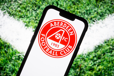 In this photo illustration, an Aberdeen FC football club logo seen displayed on a smartphone.