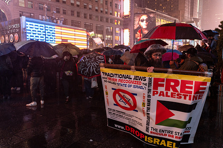 A member of the Hasidic community holds a banner regarding Zionism during a vigil for US Airman Aaron Bushnell in New York City. The member of the US Armed Forces self-immolated outside the Israeli Embassy in Washington D.C. on Sunday in protest of the ongoing conflict in Palestine and continued offensive by Israel.