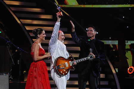 Colin Hay holds up an award from the Australian rock and Latin pop band, Men At Work during the Festival. Viña del Mar Festival is a 6-days musical show, with international artists and this year it will offer support to the people affected by the mega-fire that occurred in Chile. Everything will be broadcast to 250 million people either on open television or online.