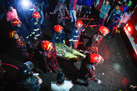 Firefighters carry an injured person during the rescue operations following a fire at a commercial building that killed at least 43 people. At least 43 people have died and dozens injured after a fire blazed through a seven-storey building in an upscale neighborhood in the Bangladeshi capital of Dhaka. On February 29, Health Minister Samanta Lal Sen told this information to reporters around 2 pm on Thursday.